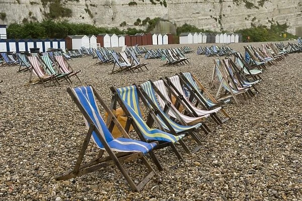 Wet summer day with unused deck chairs, Beer Beach, Devon, England, May