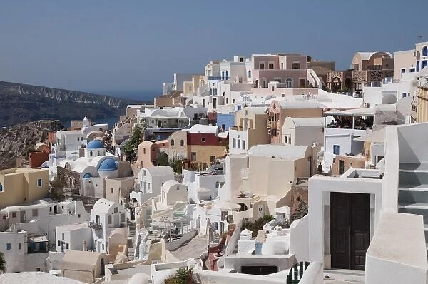 White-washed buildings in town on coastal clifftop, Oia, Santorini, Cyclades, Aegean Sea, Greece, September