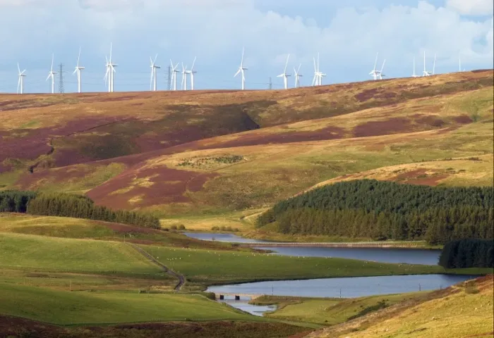 Framed Print : Wind turbines on hill above reservoir, Whiteadder Reservoir, Lammermuir Hills, Scottish Borders, Scotland, september
