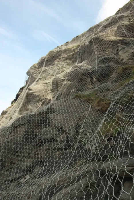 Framed Print : Wire netting used for sea cliff erosion defence, Cornwall, England, april