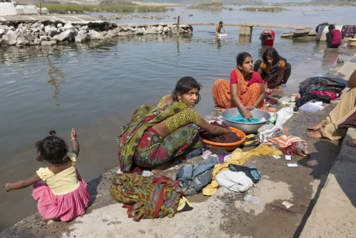 Framed Print : Women washing clothes in river, near Jabalpur, Madhya Pradesh, India, March Framed Print : Women washing clothes in river, near Jabalpur, Madhya Pradesh, India, March