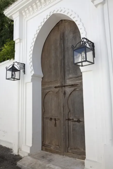 Framed Print : Wooden door and lanterns in street of coastal city, Tangier, Morocco, april Framed Print : Wooden door and lanterns in street of coastal city, Tangier, Morocco, april