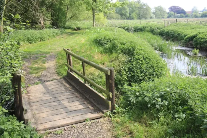 Framed Print : Wooden footbridge on footpath beside lowland river, River Rattlesden, Stowmarket, Suffolk, England, april Framed Print : Wooden footbridge on footpath beside lowland river, River Rattlesden, Stowmarket, Suffolk, England, april