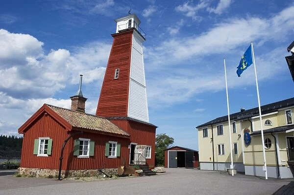 Wooden lighthouse in fishing village, Bonan, Gastrikland, Norrland, Baltic Sea, Sweden, august