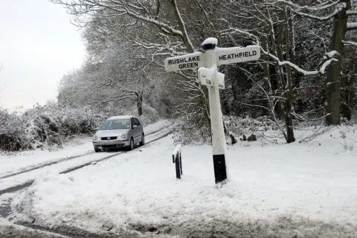 Framed Print : Wooden signpost and car in snow covered lane, near Heathfield, East Sussex, England, January Framed Print : Wooden signpost and car in snow covered lane, near Heathfield, East Sussex, England, January
