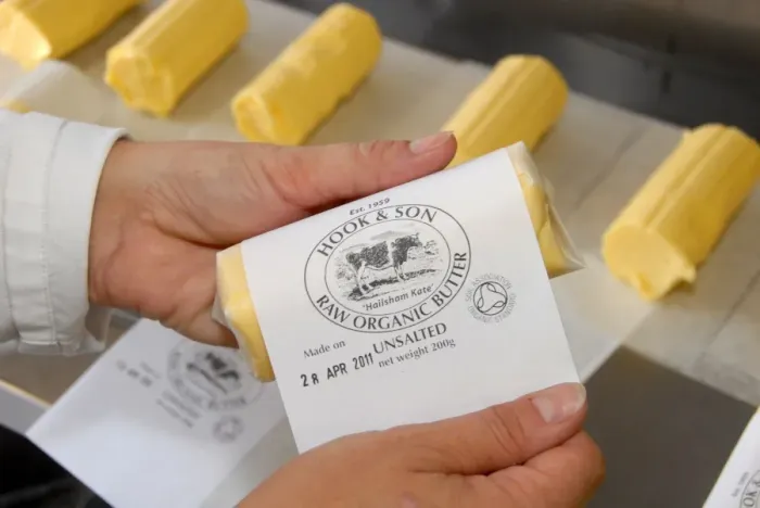 Framed Print : Worker labelling up organically made butter from unpasteurized milk, on organic dairy farm, Hook and Son Framed Print : Worker labelling up organically made butter from unpasteurized milk, on organic dairy farm, Hook and Son