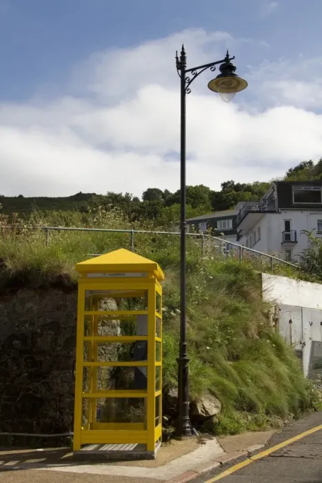 Framed Print : Yellow phone box on Jersey at Bouley Bay