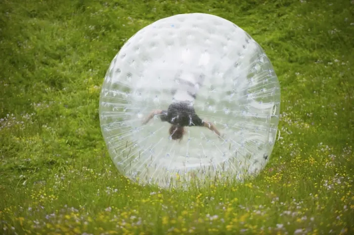 Framed Print : Zorbing, person rolling downhill in transparent plastic orb, Sweden, June Framed Print : Zorbing, person rolling downhill in transparent plastic orb, Sweden, June