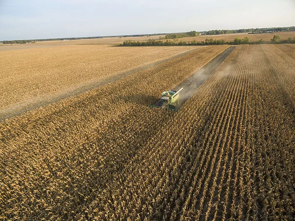 Corn Harvest, John Deere combine harvesting corn - aerial Marion Co. IL