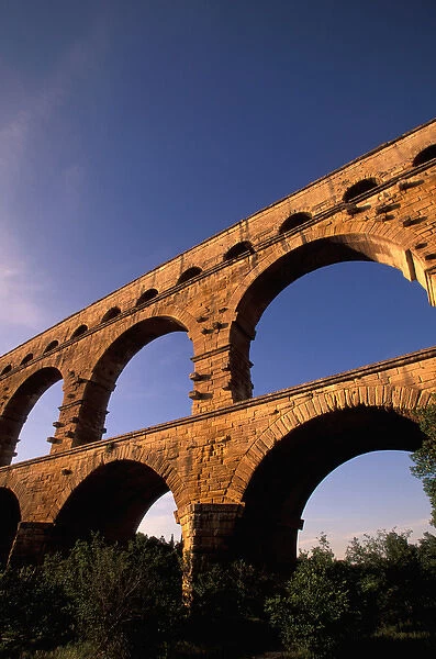 EU, France, Provence, Gard, Pont du Gard. Roman aqueduct  /  bridge in sunset light