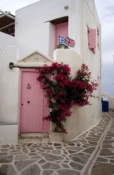 Greece, Paros, Marpissa. A restored traditional house with Greek and British flags