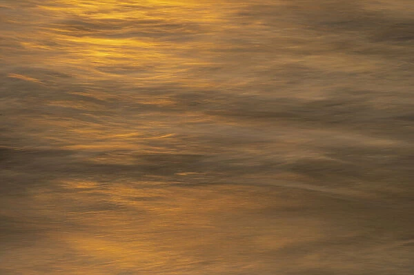 USA, New Jersey, Cape May National Seashore. Ocean reflections at sunset