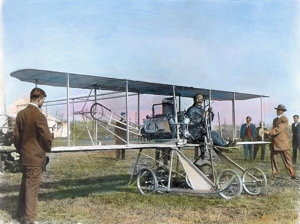 American aviation pioneer. Posing at the controls of the Baby Grand, the Wright entry in the Gordon Bennett races at Belmont Park, New York, October 1910. Oil over a photograph