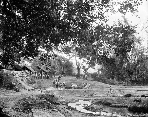 BURMA: BURMA ROAD, c1940. The old Burma Road passing through a village, with a