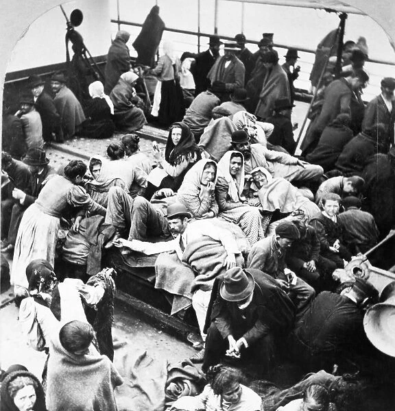 EUROPEAN IMMIGRANTS, 1902. European immigrants on the deck of a ship arriving at New York Harbor
