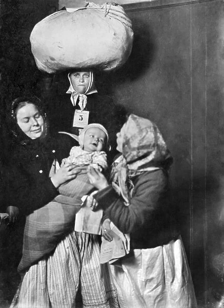 HINE: ELLIS ISLAND, 1905. A group of Italian immigrant women with a baby at Ellis Island