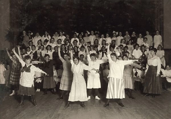 HINE: WOMANs UNION, 1916. Members of the Happy Girls Club performing a routine with hand weights