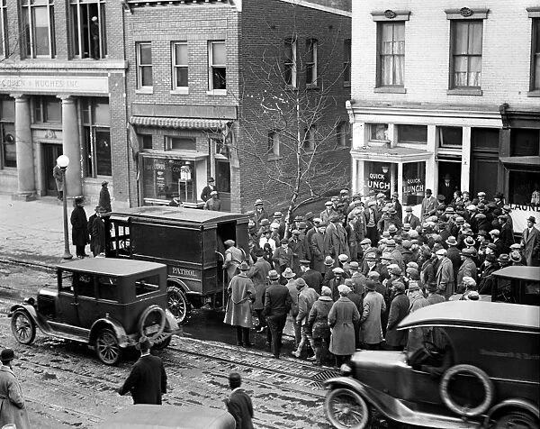 POLICE RAID, 1925. Police raid on a illegal gamblers den on East 12th Street in New York City