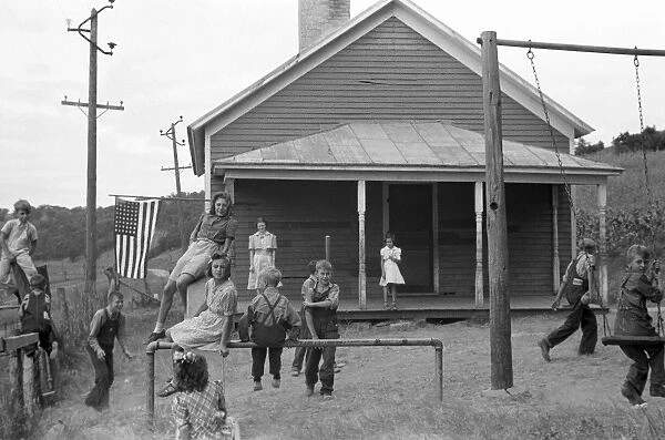 RURAL SCHOOLYARD, 1939. Children playing in the schoolyard of a rural one-room