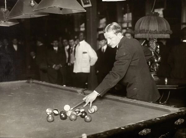 THOMAS HUESTON, 1921. The veteran billiard player, Thomas Hueston, returning to the game