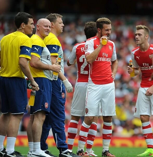 Arsenal Medical Team Tending to Calum Chambers and Aaron Ramsey during Arsenal v Benfica, Emirates Cup 2014-15