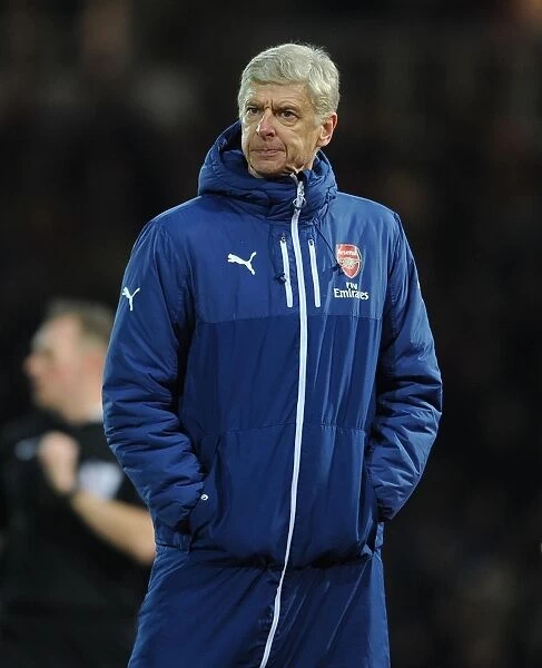 Arsene Wenger Leads Arsenal Against West Ham United in Premier League Clash (2014-15)