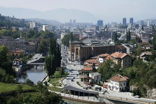 Bosnia and Herzegovina, Sarajevo, overview from hillside with river and distant mountains
