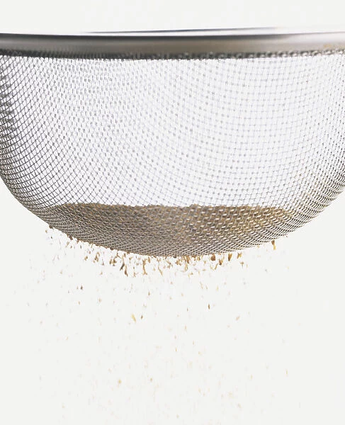 Close-up of fine powder in a sieve