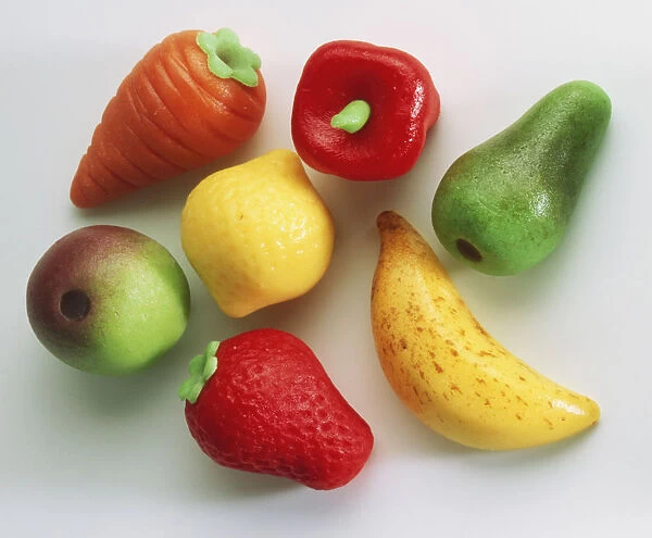 Colourful selection of marzipan sweets shaped as different fruit and vegetables, close up