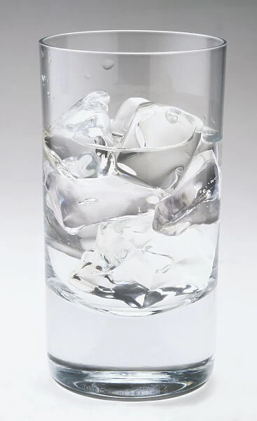 Glass filled with ice cubes