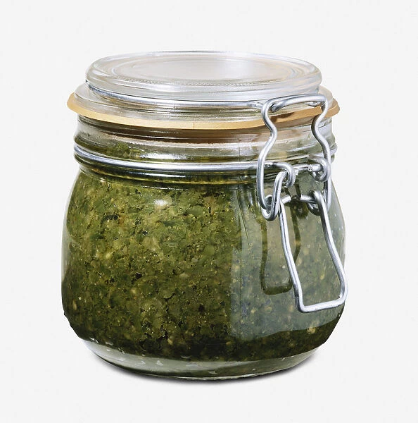 Glass jar of green chilli sauce (skhug)