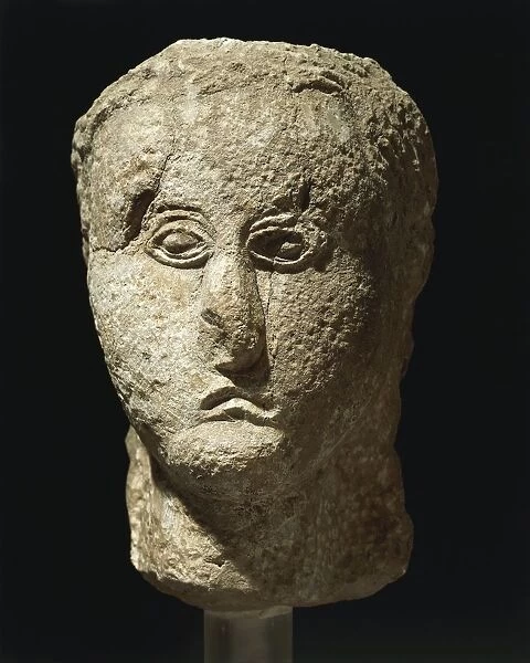 Head of stone deity