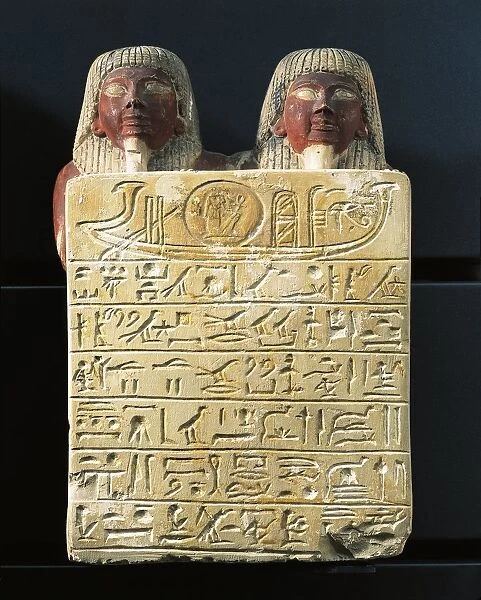 Limestone stele of Dydy and his son Pendua, master carpenters, offering hymn to the sun god Ra, from Deir el-Medina