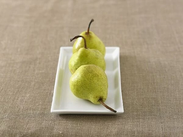 Three pears on a rectangular plate