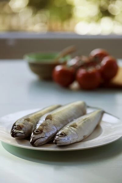 Three sardines on a plate