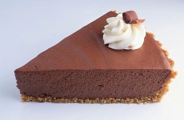 A slice of chocolate pie decorated with cream