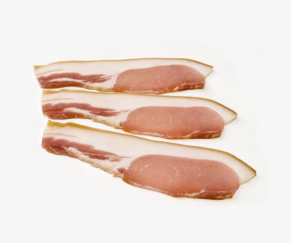 Three slices of smoked bacon, close-up