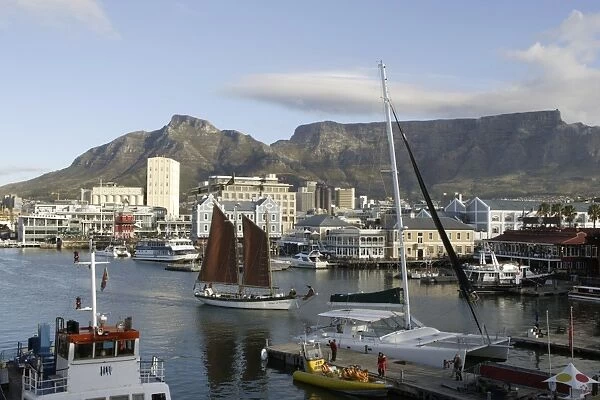 South Africa, Cape Town, Victoria and Alfred Waterfront, view of main basin with sailing ship, and Table Mountain in the background