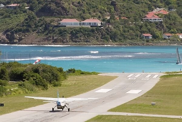 St Barthelemy, plane on runway by the sea