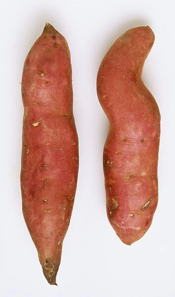 Two sweet potatoes with pink skin