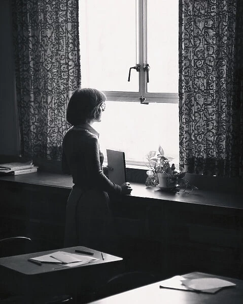 Teacher looking at window