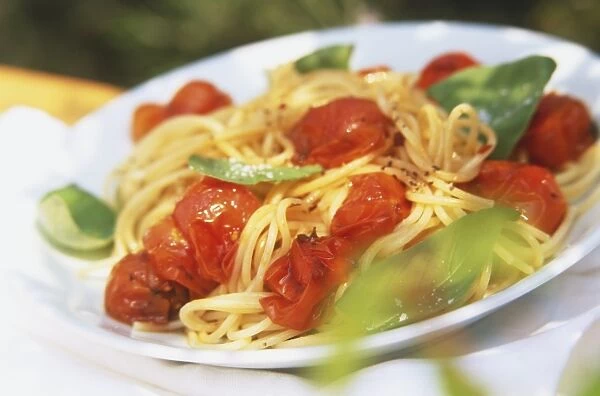 Tomato and basil spaghetti, served on a plate
