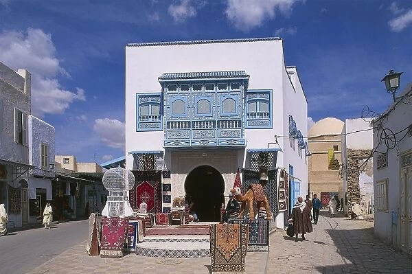 Tunisia, Kairouan, Old Town, Bourguiba Avenue, typical blue balcony and carpet sellers