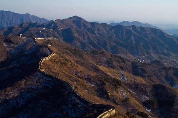 Great Wall of China extending over mountain range
