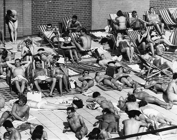 Heatwave. A crowd of sunbathers at the Oasis open-air swimming pool