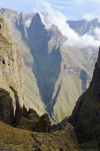 Mountain Pass with sharp peak and low lying cloud in background, Mweni, Drakensberg, Kwazulu Natal, South Africa