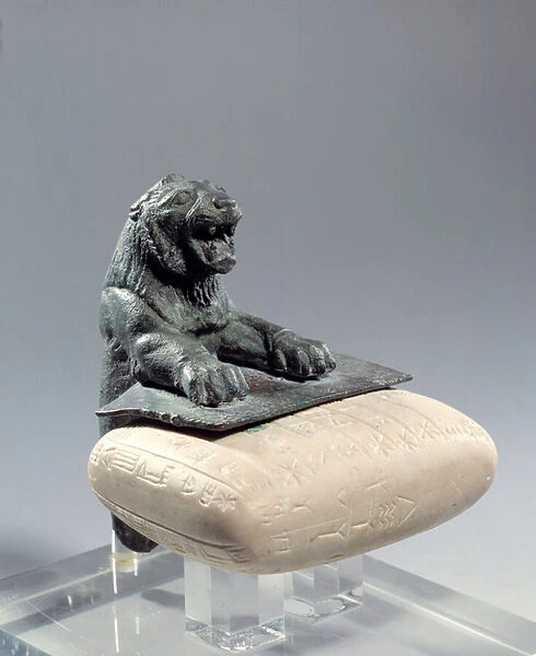 Bronze lion holding a foundation tablet in Hurrite language