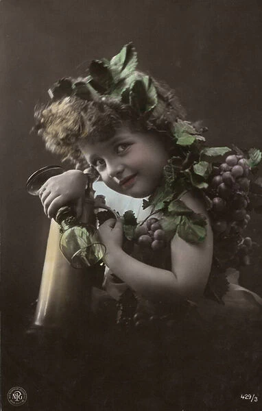 Child with bunches of grapes (colour photo)