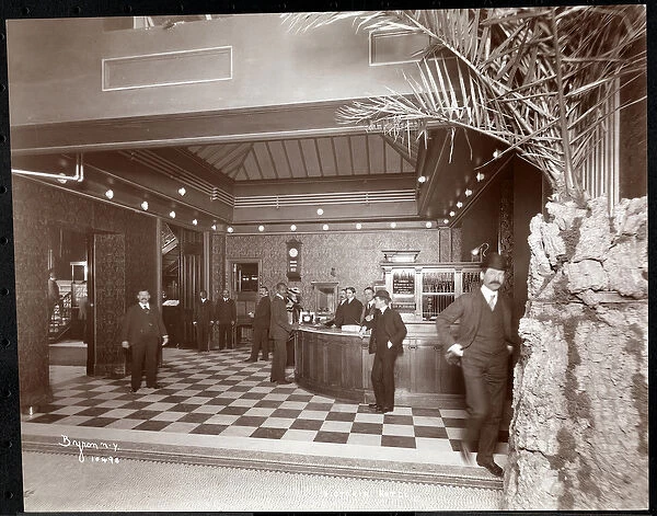 The lobby and registration desk at the Hotel Victoria, 1900 or 1901 (silver gelatin print