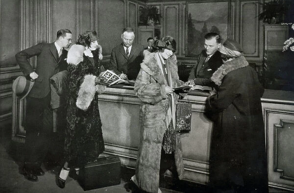 Passengers purchasing tickets at the ticket office of the Great Northern Railway, Chicago